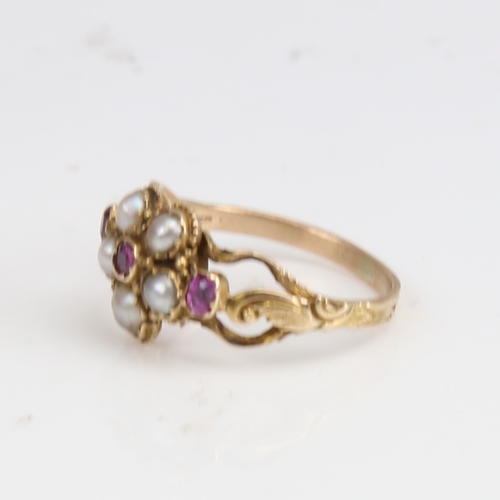 1227 - A Victorian unmarked gold split-pearl and ruby cluster memorial ring, central flowerhead design with... 