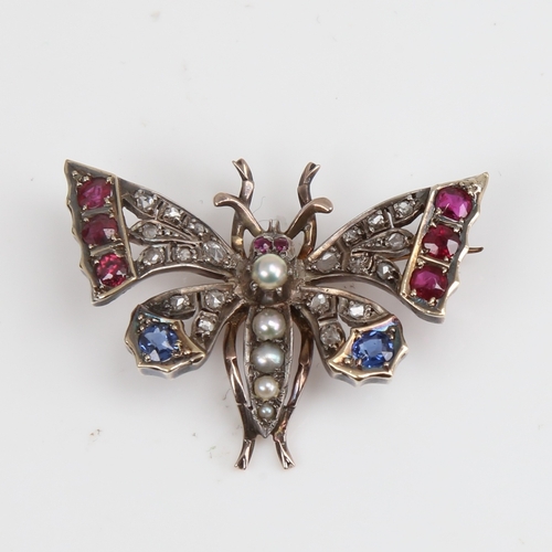 1228 - A Victorian unmarked gold ruby sapphire pearl and diamond figural butterfly brooch, set with round-c... 