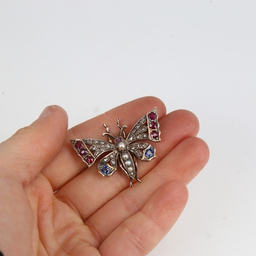 1228 - A Victorian unmarked gold ruby sapphire pearl and diamond figural butterfly brooch, set with round-c... 