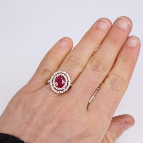 1229 - A modern 14ct rose gold ruby and diamond cluster double-halo ring, set with oval mixed-cut ruby and ... 