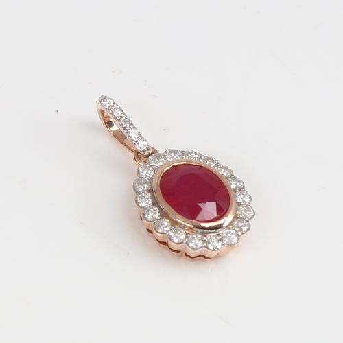 1230 - A modern 14ct rose gold ruby and diamond cluster pendant, set with oval mixed-cut ruby and round bri... 