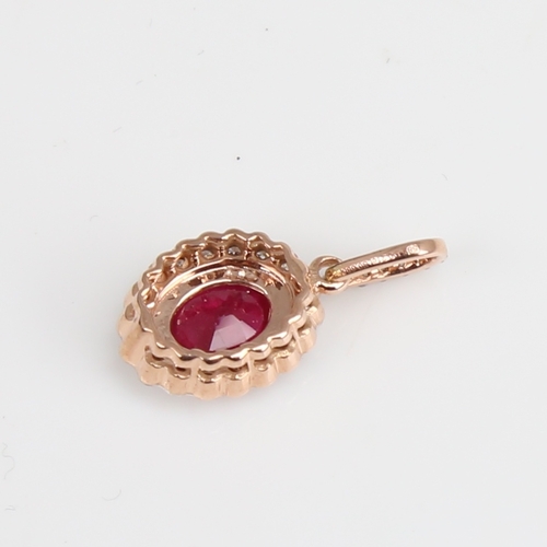 1230 - A modern 14ct rose gold ruby and diamond cluster pendant, set with oval mixed-cut ruby and round bri... 