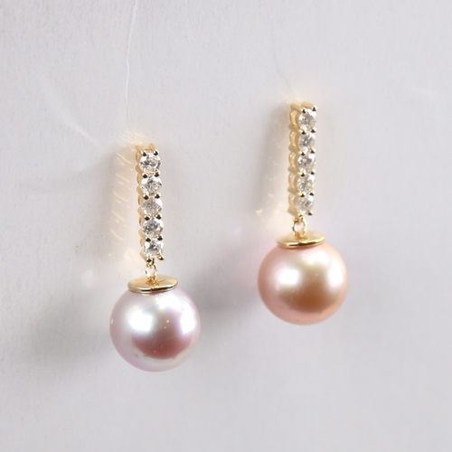 1233 - A modern pair of 14ct gold whole Southsea cultured pearl and diamond drop earrings, set with round b... 