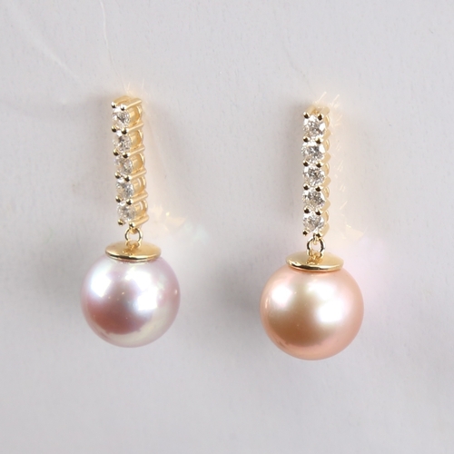 1233 - A modern pair of 14ct gold whole Southsea cultured pearl and diamond drop earrings, set with round b... 