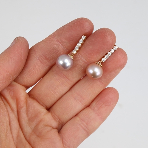 1233 - A modern pair of 14ct gold whole Southsea cultured pearl and diamond drop earrings, set with round b... 