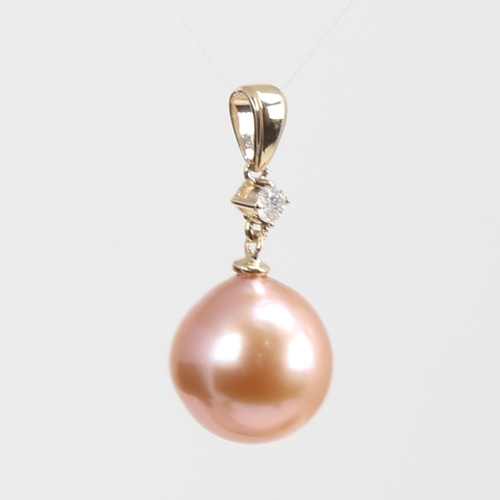 1234 - A modern 14ct gold whole Southsea pearl and diamond drop pendant, set with 0.05ct round brilliant-cu... 