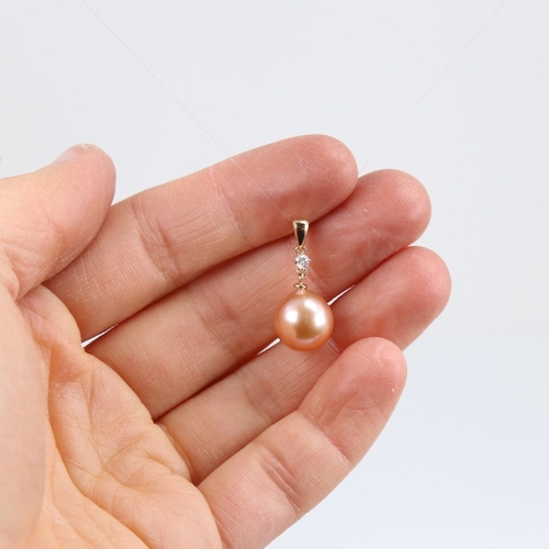 1234 - A modern 14ct gold whole Southsea pearl and diamond drop pendant, set with 0.05ct round brilliant-cu... 