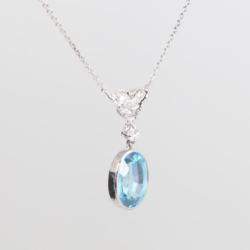 1242 - A platinum zircon and diamond pendant necklace, set with 9ct oval mixed-cut zircon drop and round br... 