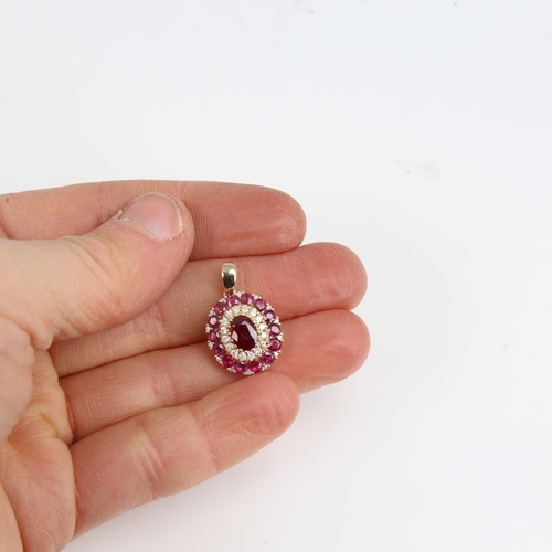 1243 - A modern 14ct gold ruby and diamond cluster pendant, set with oval mixed and round-cut rubies with r... 