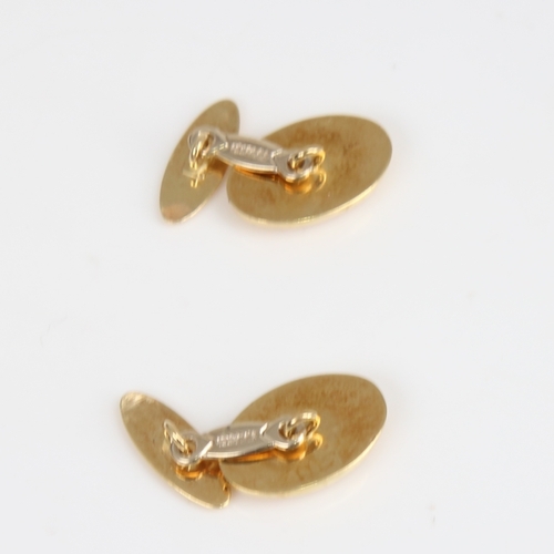 1245 - A pair of Italian 18ct gold oval cufflinks, panel length 16.4mm, 5.8g