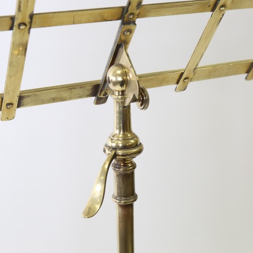 437 - A Victorian brass music stand on tripod base with telescopic adjustment, max height 155cm