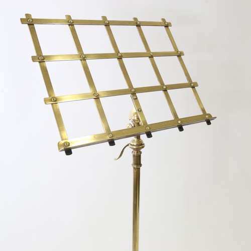 437 - A Victorian brass music stand on tripod base with telescopic adjustment, max height 155cm