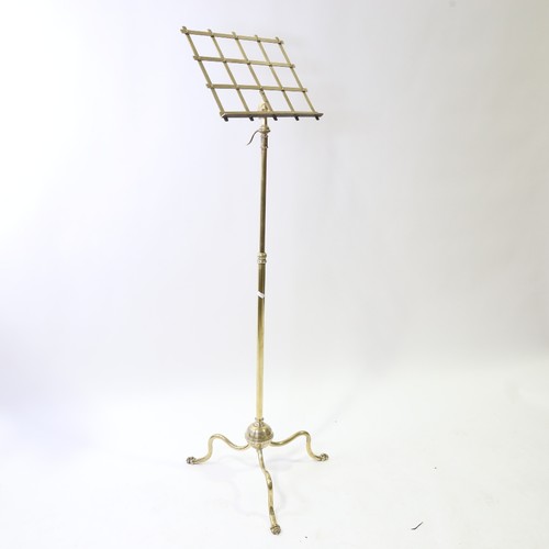 437 - A Victorian brass music stand on tripod base with telescopic adjustment, max height 155cm