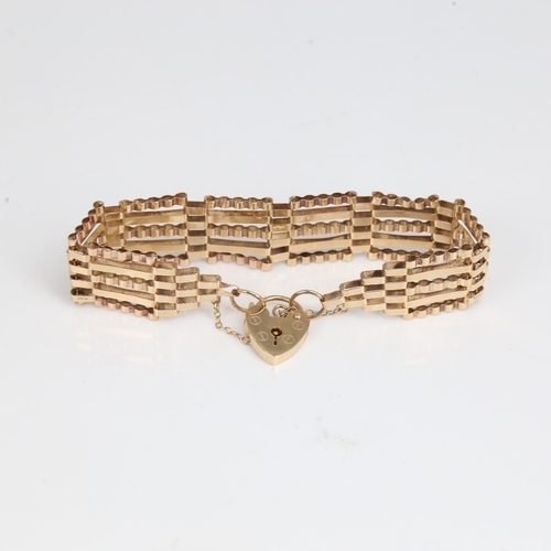 1250 - A late 20th century 9ct gold gate link heart padlock bracelet, maker's marks ASJ, hallmarks London 1... 