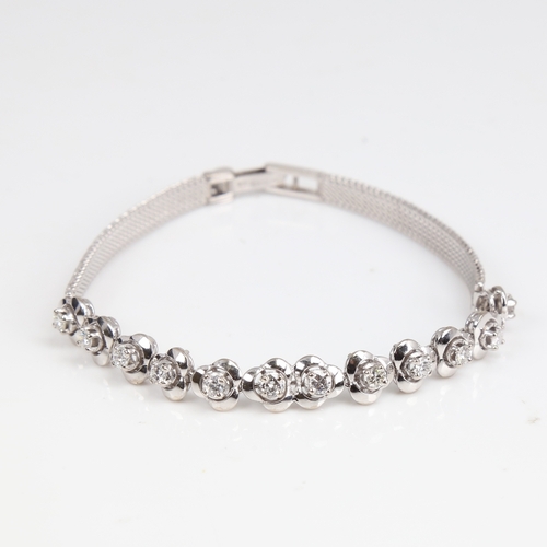 1256 - A late 20th century 18ct white gold diamond trefoil bracelet, set with round brilliant-cut diamonds,... 