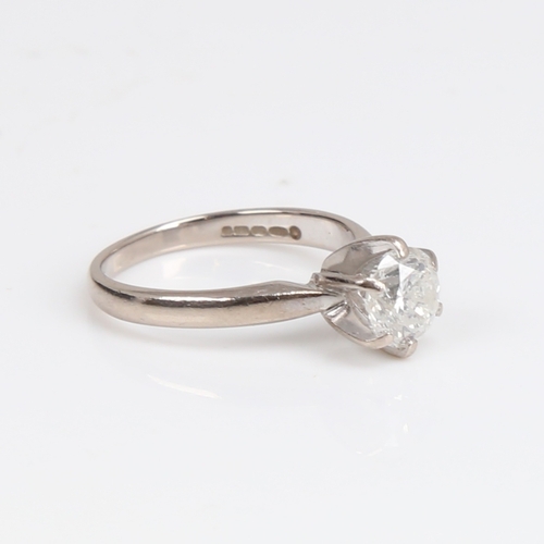 1257 - A modern 18ct white gold 1.2ct solitaire diamond ring, plain 6-claw cage setting with modern round b... 