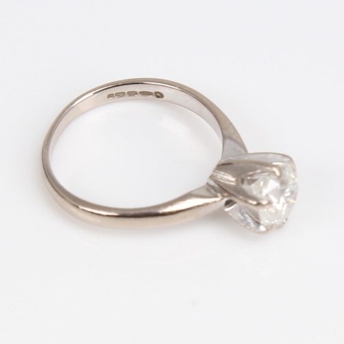 1257 - A modern 18ct white gold 1.2ct solitaire diamond ring, plain 6-claw cage setting with modern round b... 