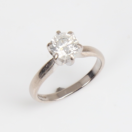 1257 - A modern 18ct white gold 1.2ct solitaire diamond ring, plain 6-claw cage setting with modern round b... 