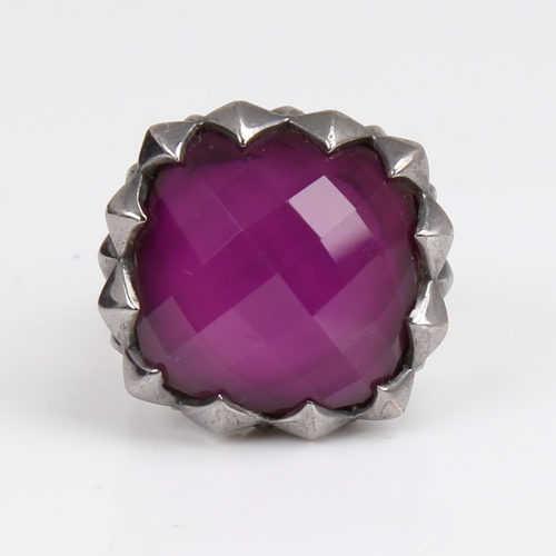 1259 - A large modern designer sterling silver and amethyst ring, large facet-cut amethyst with Gothic styl... 