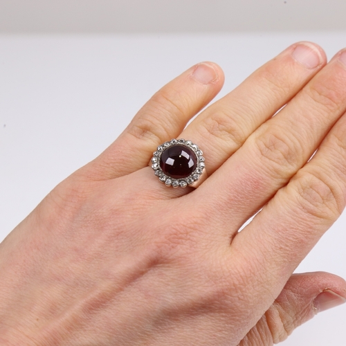 1260 - An Antique unmarked gold cabochon garnet and diamond cluster ring, set with round cabochon foil-back... 