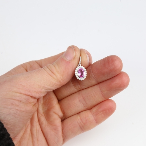 1261 - A modern 14ct white gold pink sapphire and diamond cluster drop pendant, set with oval mixed-cut sap... 