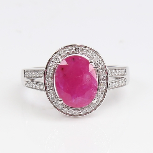 1262 - A modern 14ct white gold pink sapphire and diamond cluster ring, set with oval mixed-cut sapphire an... 