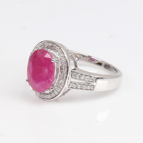 1262 - A modern 14ct white gold pink sapphire and diamond cluster ring, set with oval mixed-cut sapphire an... 