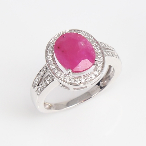 1262 - A modern 14ct white gold pink sapphire and diamond cluster ring, set with oval mixed-cut sapphire an... 