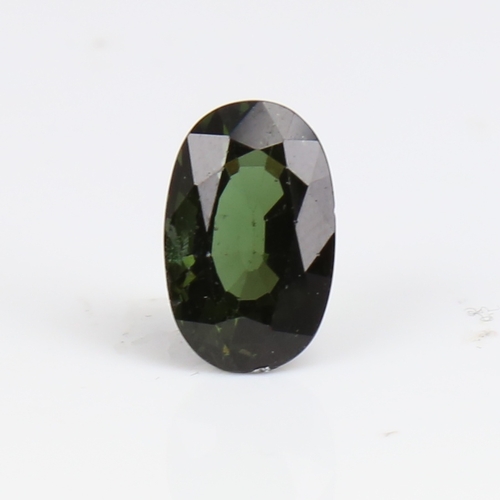 1266 - A 6.73ct unmounted oval mixed-cut green tourmaline, dimensions: 14.66mm x 9.27mm x 7.08mm, 1.36g