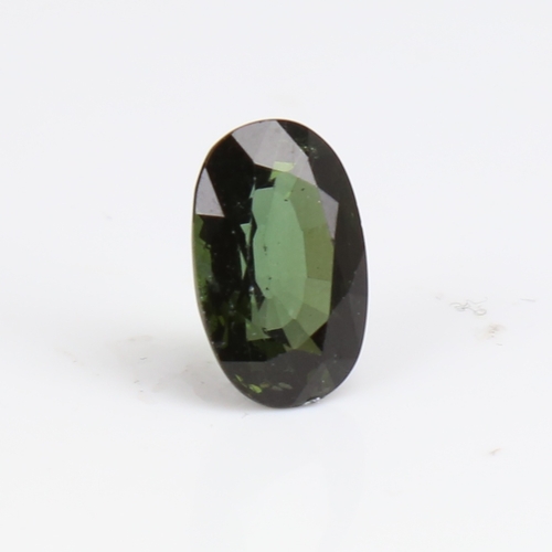 1266 - A 6.73ct unmounted oval mixed-cut green tourmaline, dimensions: 14.66mm x 9.27mm x 7.08mm, 1.36g