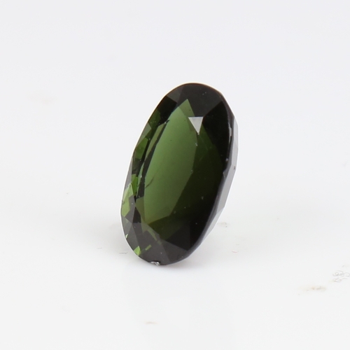 1266 - A 6.73ct unmounted oval mixed-cut green tourmaline, dimensions: 14.66mm x 9.27mm x 7.08mm, 1.36g