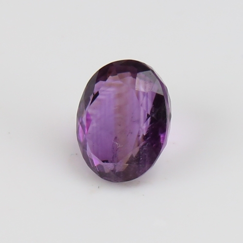 1287 - A 5.46ct unmounted oval mixed-cut amethyst, dimensions: 12.40mm x 9.99mm x 6.64mm, 1.09g, with GJSPC... 