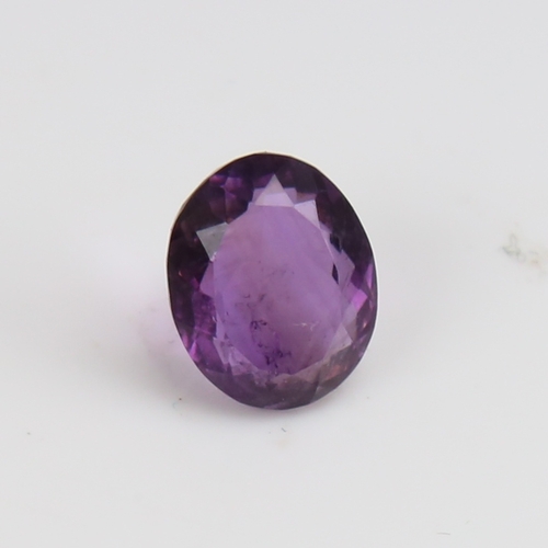 1287 - A 5.46ct unmounted oval mixed-cut amethyst, dimensions: 12.40mm x 9.99mm x 6.64mm, 1.09g, with GJSPC... 