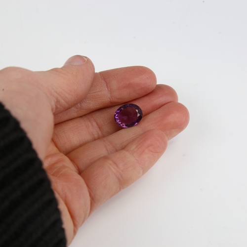 1287 - A 5.46ct unmounted oval mixed-cut amethyst, dimensions: 12.40mm x 9.99mm x 6.64mm, 1.09g, with GJSPC... 