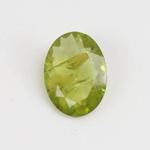 1290 - A 5.07ct unmounted oval mixed-cut peridot, dimensions: 14.70mm x 10.88mm x 4.05mm, 1.01g, with IDT C... 