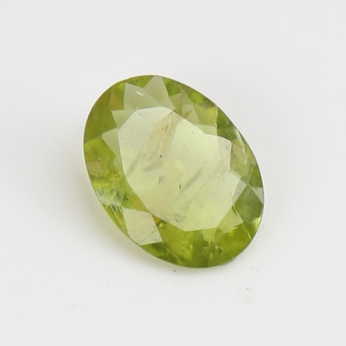 1290 - A 5.07ct unmounted oval mixed-cut peridot, dimensions: 14.70mm x 10.88mm x 4.05mm, 1.01g, with IDT C... 