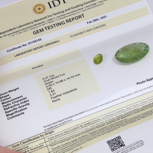 1290 - A 5.07ct unmounted oval mixed-cut peridot, dimensions: 14.70mm x 10.88mm x 4.05mm, 1.01g, with IDT C... 