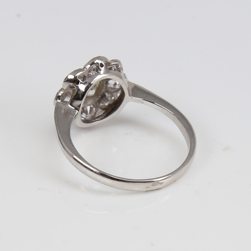 1292 - An unmarked white gold diamond cluster flowerhead ring, set with modern round brilliant-cut diamonds... 