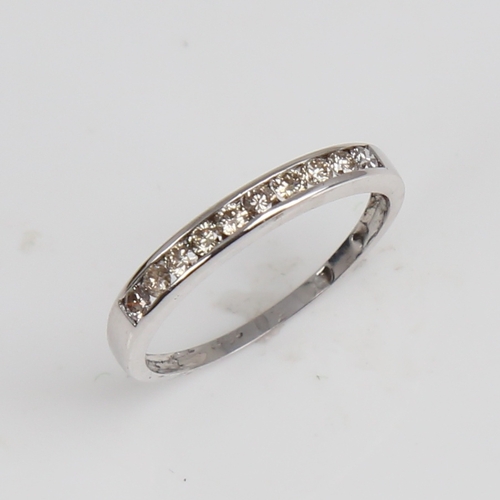 1294 - A modern 9ct white gold diamond half eternity ring, set with modern round brilliant-cut diamonds, to... 