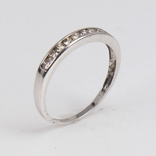 1294 - A modern 9ct white gold diamond half eternity ring, set with modern round brilliant-cut diamonds, to... 