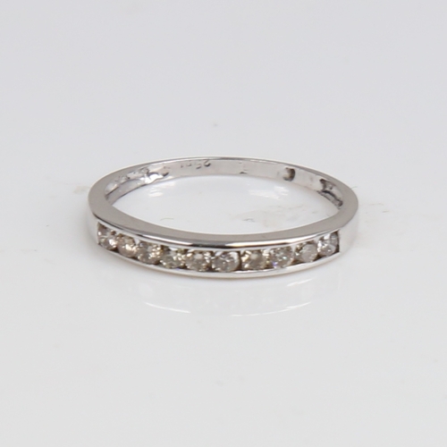 1294 - A modern 9ct white gold diamond half eternity ring, set with modern round brilliant-cut diamonds, to... 