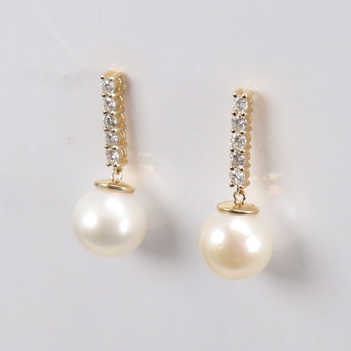 1295 - A modern pair of 14ct gold whole Southsea cultured pearl and diamond drop earrings, set with modern ... 