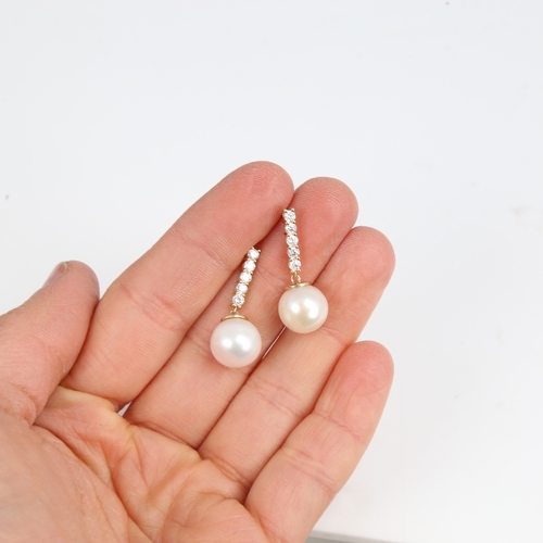 1295 - A modern pair of 14ct gold whole Southsea cultured pearl and diamond drop earrings, set with modern ... 