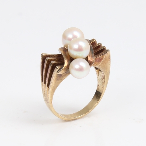 1297 - MIKIMOTO - an Art Deco style 14ct gold pearl dress ring, openwork stylised shoulders, setting height... 