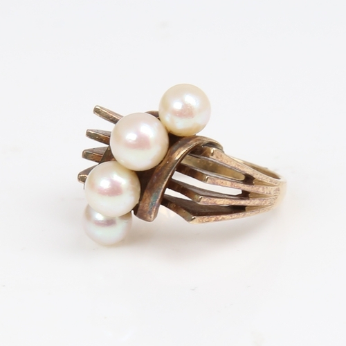 1297 - MIKIMOTO - an Art Deco style 14ct gold pearl dress ring, openwork stylised shoulders, setting height... 