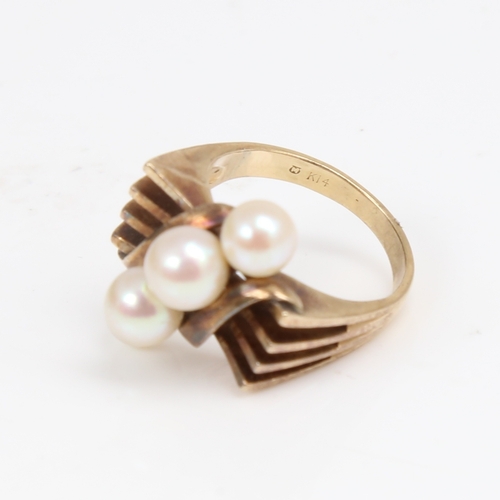 1297 - MIKIMOTO - an Art Deco style 14ct gold pearl dress ring, openwork stylised shoulders, setting height... 