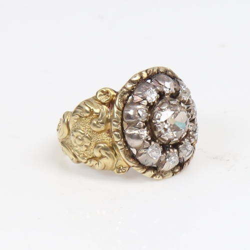 1299 - A large 19th century unmarked gold diamond cluster ring, set with old-cut diamonds and relief floral... 