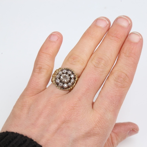 1299 - A large 19th century unmarked gold diamond cluster ring, set with old-cut diamonds and relief floral... 