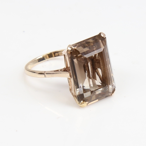 1389 - A large late 20th century 9ct gold smoky quartz ring, quartz length 20.2mm, size Q, 6.9g