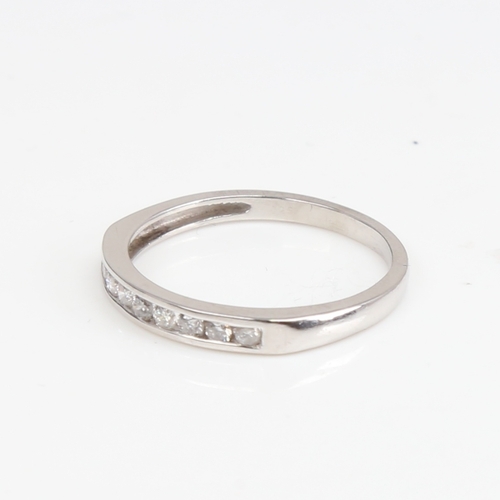 1393 - A modern unmarked white gold diamond half eternity ring, set with modern round brilliant-cut diamond... 